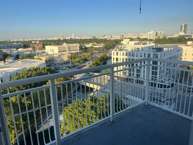 a view of a balcony with city
