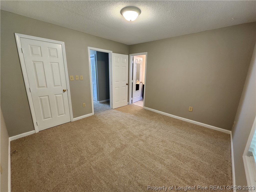 6111 Sunpointe Drive, Unit 104 Raleigh, NC 27606 - Photo 29 of 49 a view of an empty room and closet area