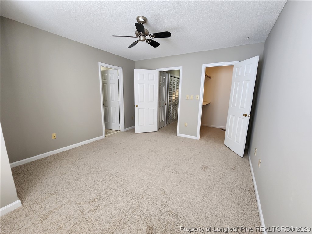 6111 Sunpointe Drive, Unit 104 Raleigh, NC 27606 - Photo 39 of 49 an empty room with closet and windows