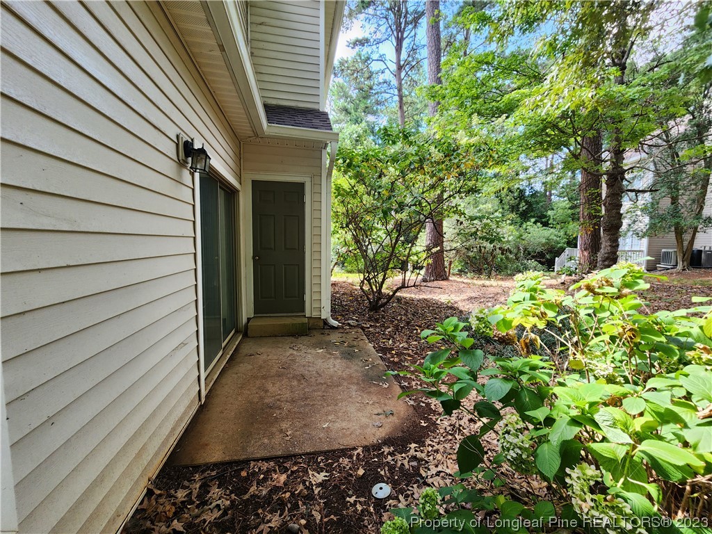 6111 Sunpointe Drive, Unit 104 Raleigh, NC 27606 - Photo 46 of 49 a view of a house with a yard