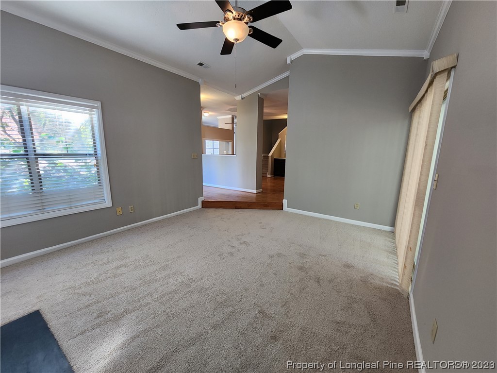 6111 Sunpointe Drive, Unit 104 Raleigh, NC 27606 - Photo 7 of 49 a view of an empty room with a window