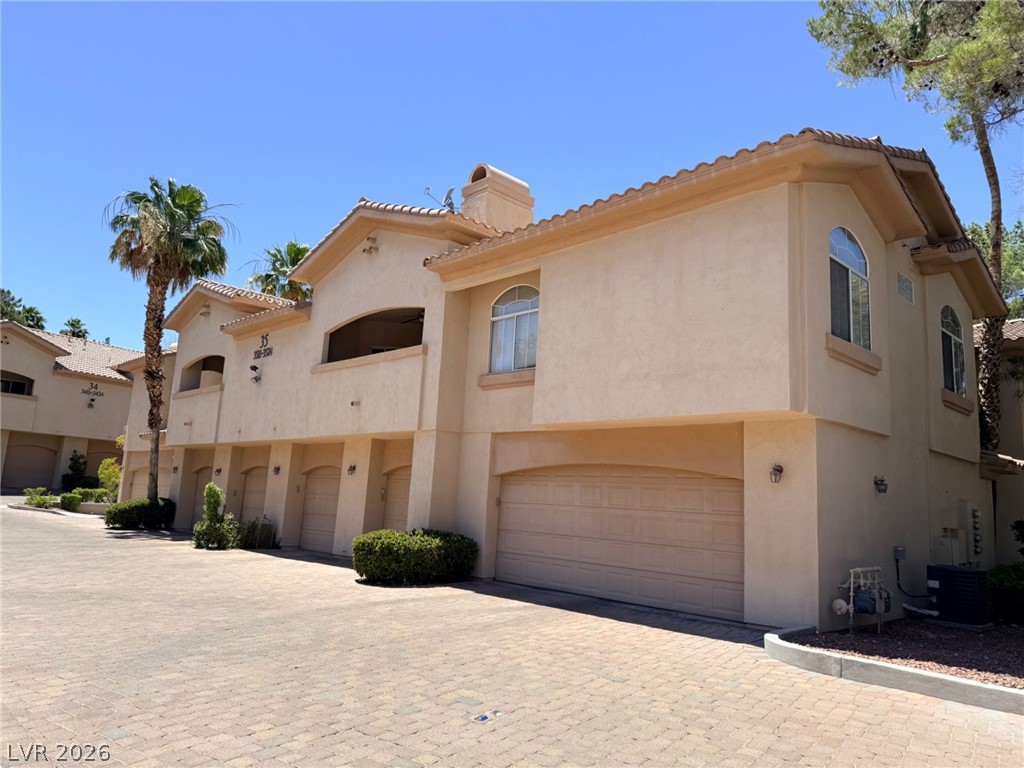 2050 West Warm Springs Road, Unit 3521 Henderson, NV 89014 - Photo 1 of 12 A classic stucco facade with a tile roof provides a timeless and elegant curb appeal.