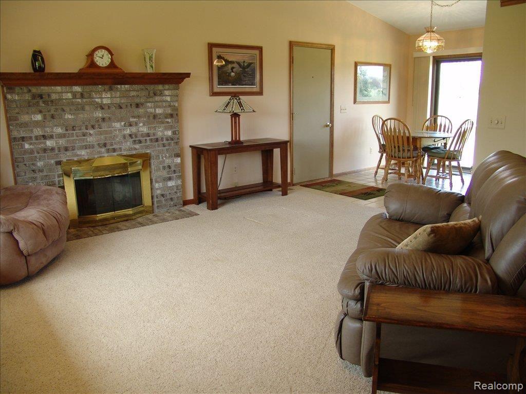 300 West Barron Road Howell, MI 48855 - Photo 4 of 13 family room w/ real fireplace