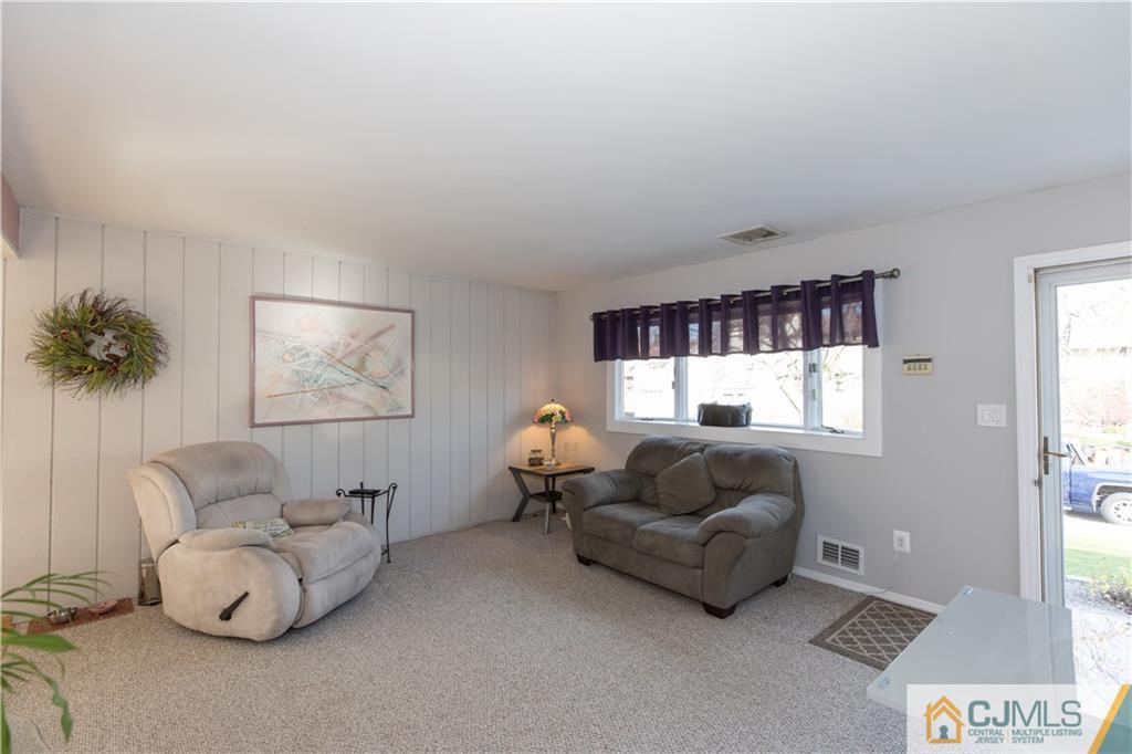 205 North Hill Road Colonia, NJ 07067 - Photo 2 of 25 a living room with furniture and a window