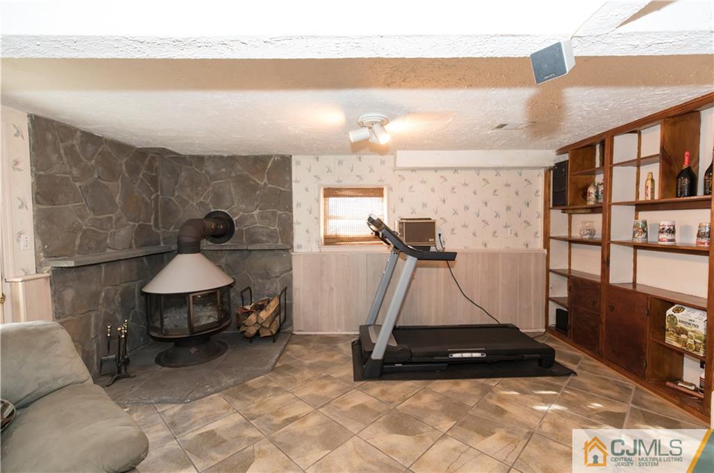 205 North Hill Road Colonia, NJ 07067 - Photo 14 of 25 a living room with a couch and a table