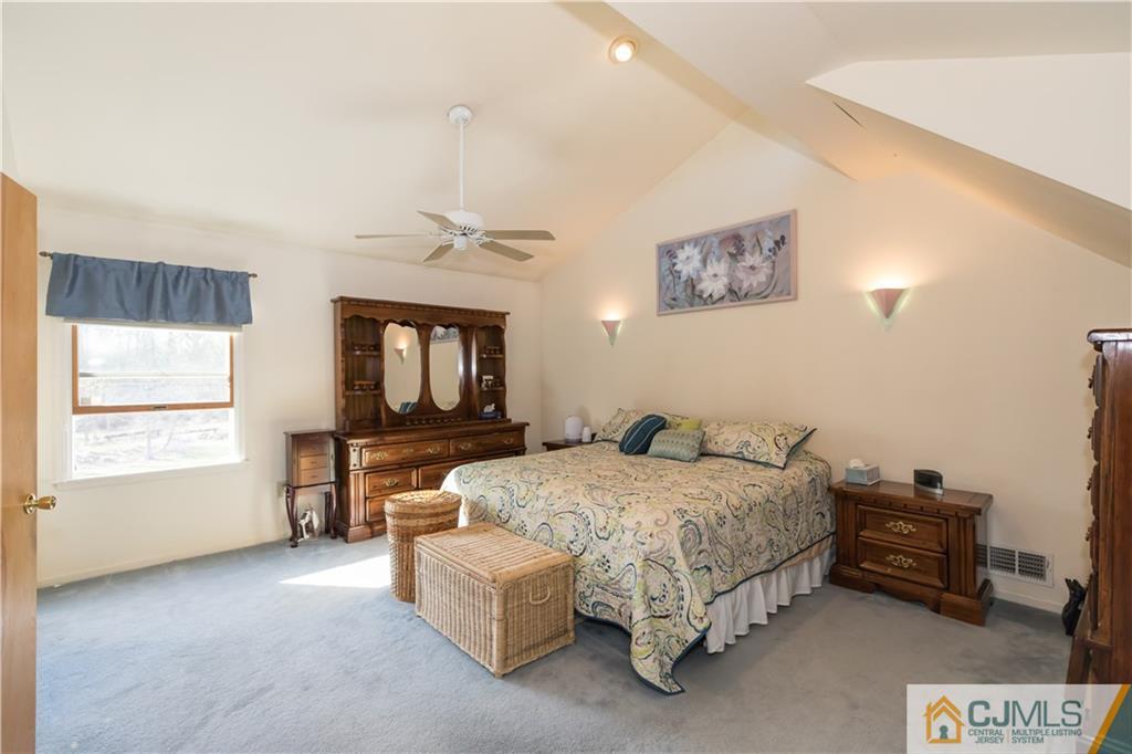 205 North Hill Road Colonia, NJ 07067 - Photo 15 of 25 a bedroom with a bed and a window