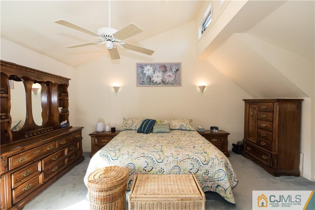 205 North Hill Road Colonia, NJ 07067 - Photo 16 of 25 a bedroom with a bed and a flat screen tv
