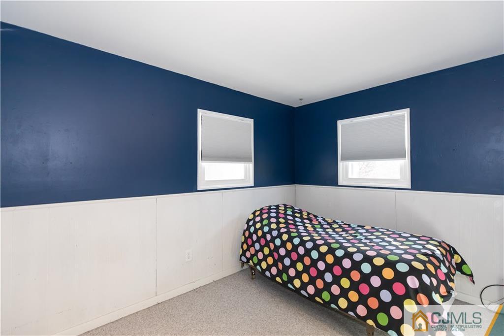 205 North Hill Road Colonia, NJ 07067 - Photo 18 of 25 a bedroom with a bed and window