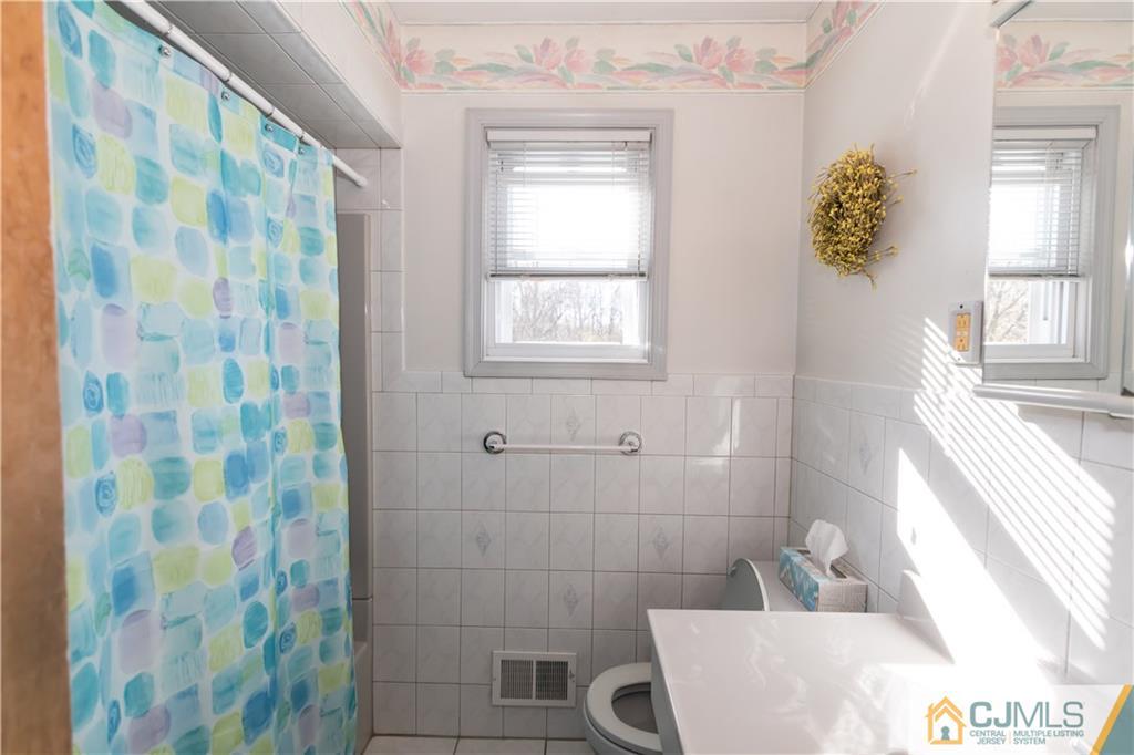 205 North Hill Road Colonia, NJ 07067 - Photo 19 of 25 a bath room with a sink and a tub