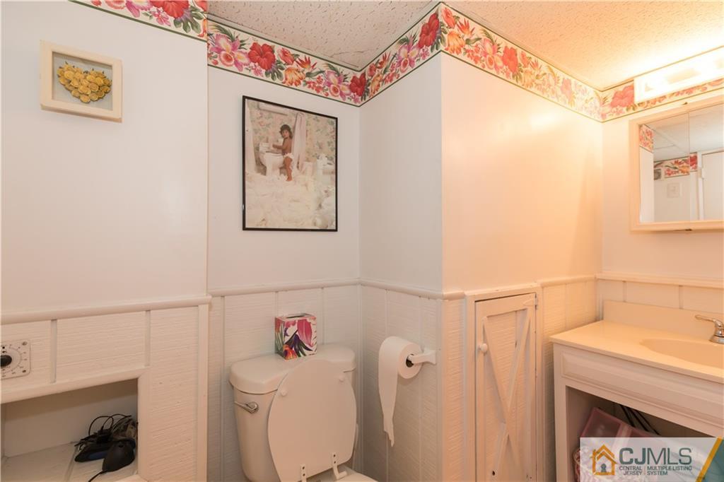 205 North Hill Road Colonia, NJ 07067 - Photo 21 of 25 a bathroom with a sink and a toilet