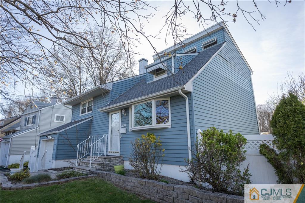205 North Hill Road Colonia, NJ 07067 - Photo 23 of 25 a front view of a house with a yard