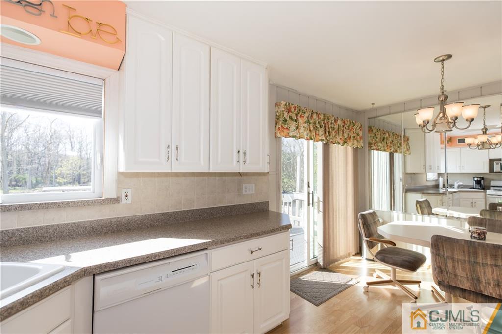 205 North Hill Road Colonia, NJ 07067 - Photo 5 of 25 a kitchen with a sink cabinets and window