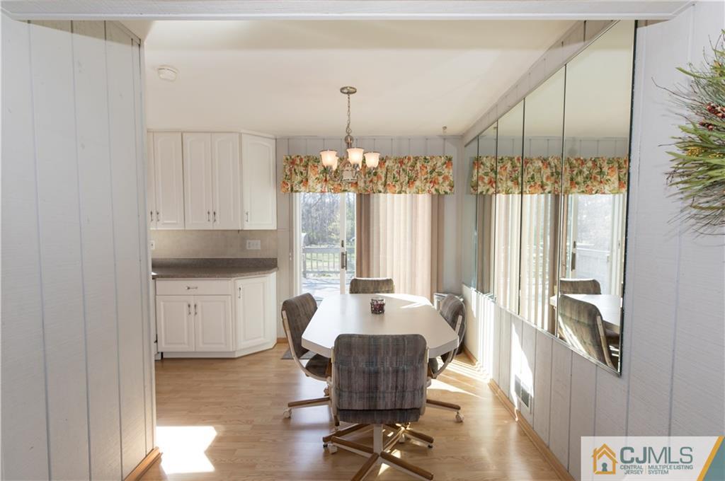 205 North Hill Road Colonia, NJ 07067 - Photo 7 of 25 a living room with furniture and a chandelier