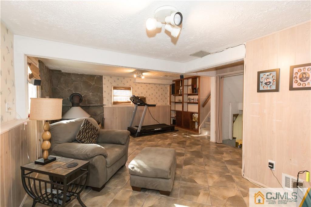 205 North Hill Road Colonia, NJ 07067 - Photo 10 of 25 a living room with furniture and a ceiling fan