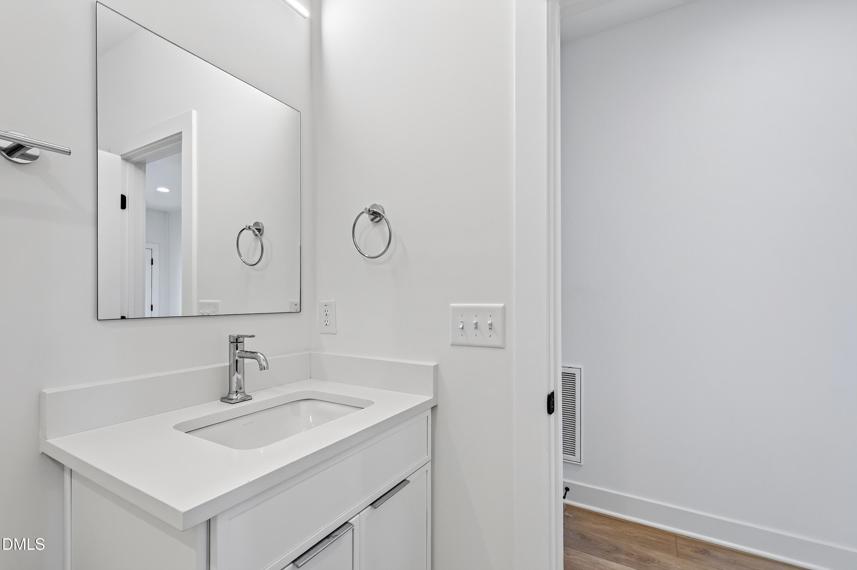 1317 Garner Road, Unit 102 Raleigh, NC 27610 - Photo 12 of 44 a bathroom with a sink and a mirror