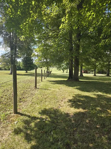 a view of a golf course with a lake view