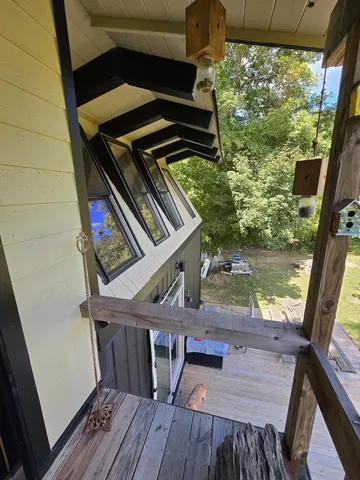 a view of deck with patio and wooden floor