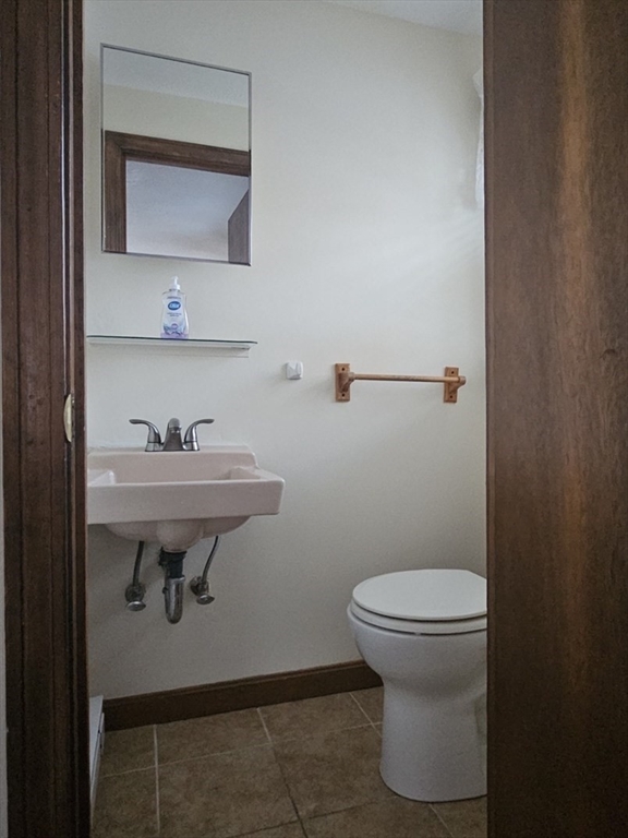 27 Summer Street, Unit 27 Chelmsford, MA 01824 - Photo 11 of 15 a bathroom with a sink toilet and a mirror