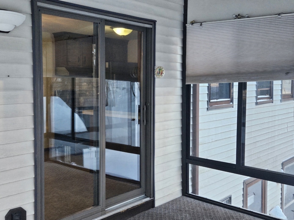 27 Summer Street, Unit 27 Chelmsford, MA 01824 - Photo 14 of 15 a view of a balcony from a door