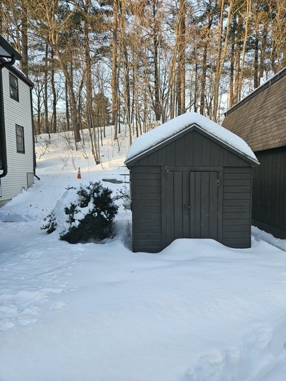 27 Summer Street, Unit 27 Chelmsford, MA 01824 - Photo 15 of 15 a view of a wooden house with a yard