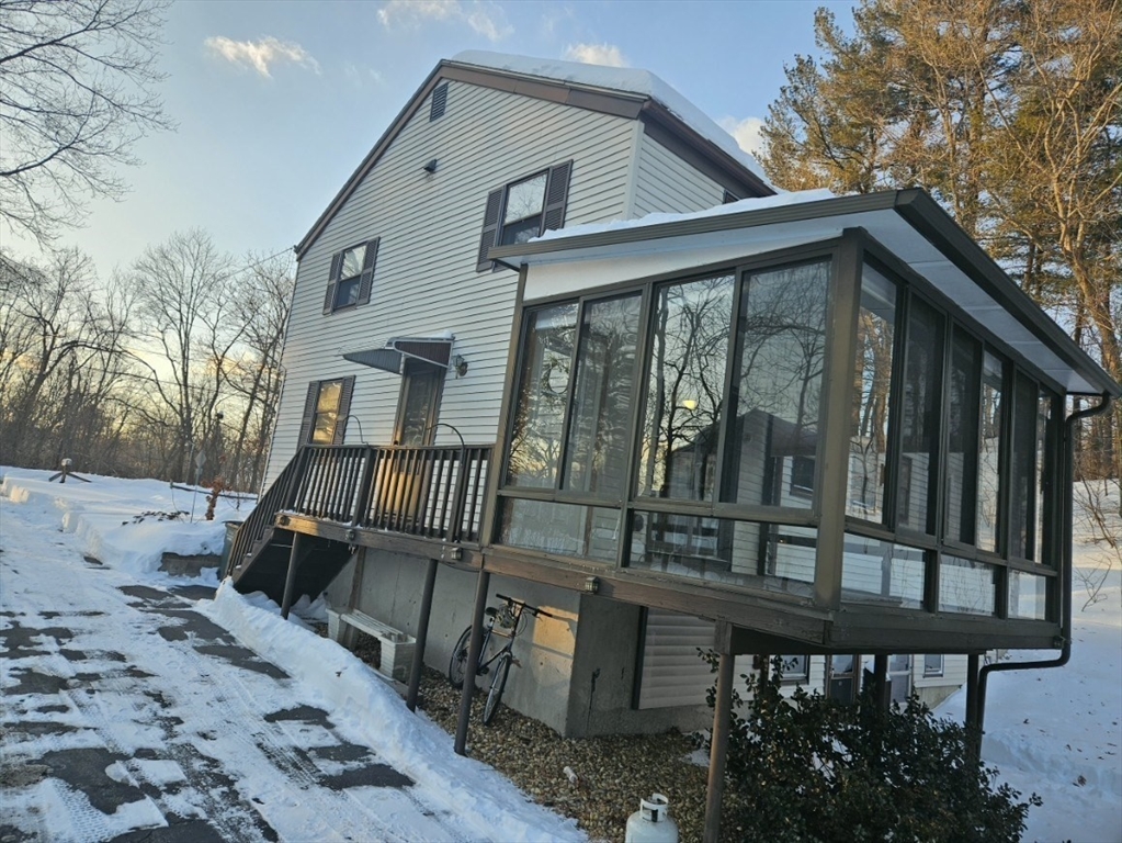 27 Summer Street, Unit 27 Chelmsford, MA 01824 - Photo 2 of 15 a view of wooden house with large windows