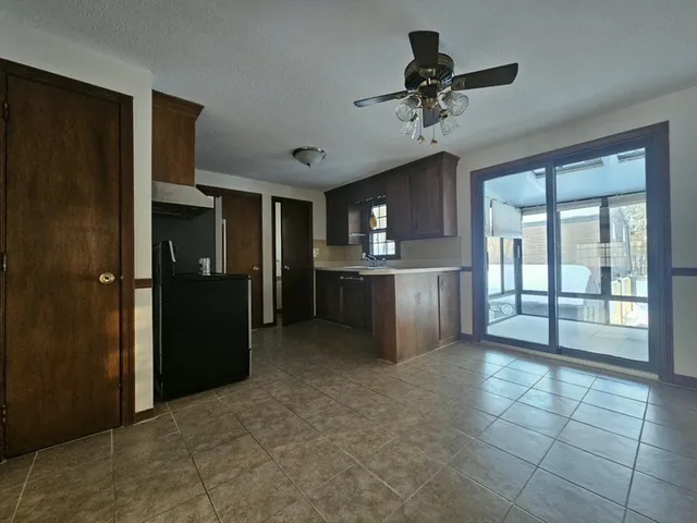 a view of a kitchen with a sink and cabinet area