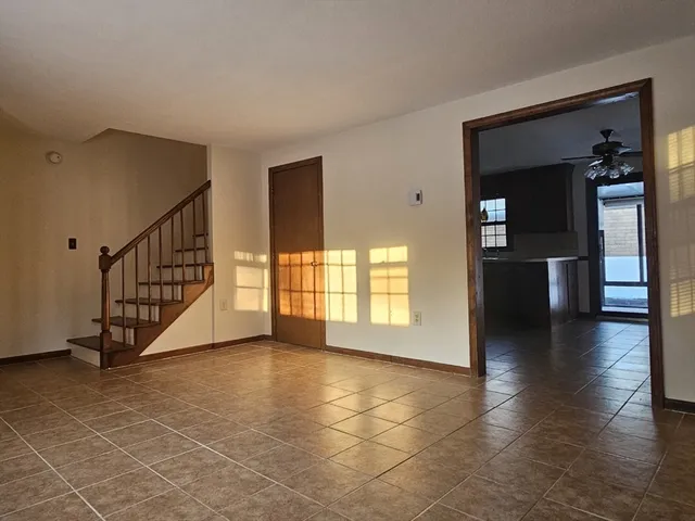 a view of an entryway with wooden floor