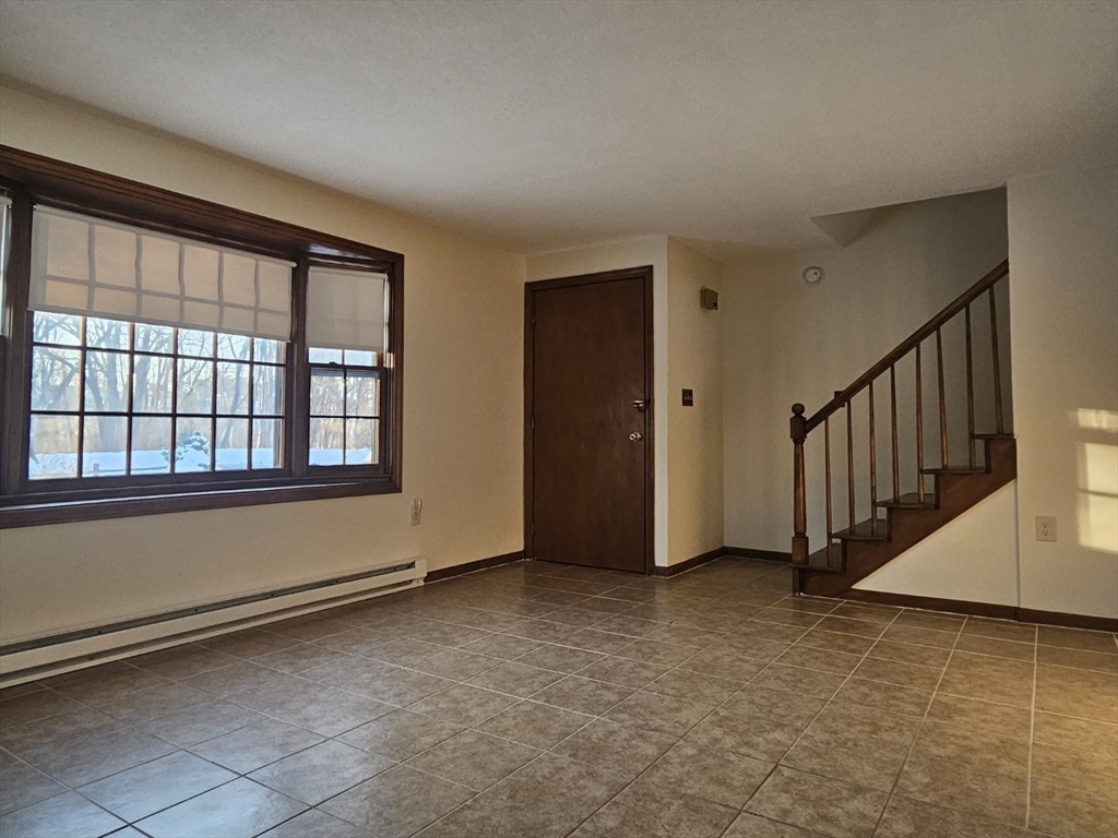 27 Summer Street, Unit 27 Chelmsford, MA 01824 - Photo 6 of 15 a view of an empty room with a window