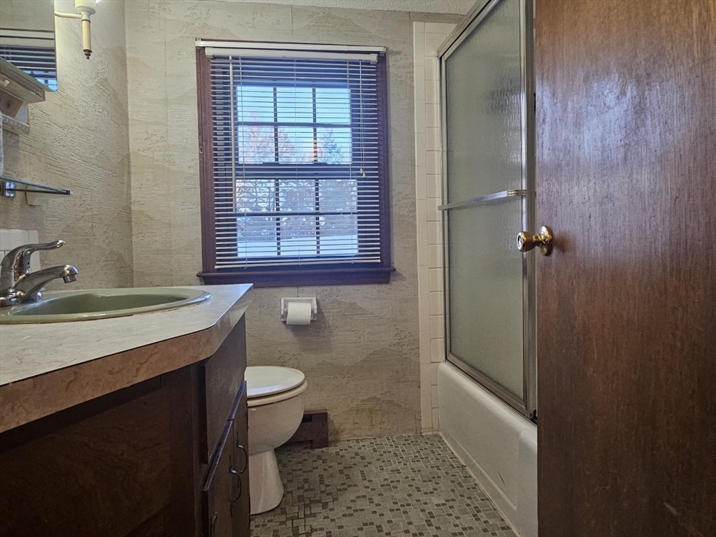 27 Summer Street, Unit 27 Chelmsford, MA 01824 - Photo 7 of 15 a bathroom with a granite countertop sink toilet and shower