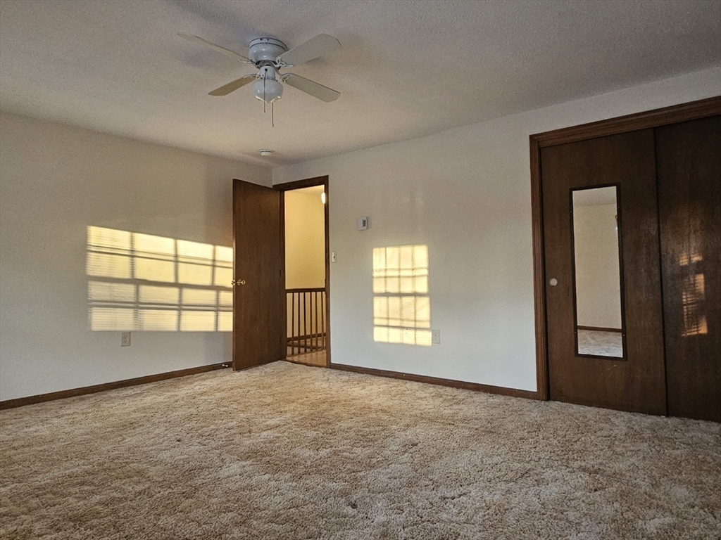 27 Summer Street, Unit 27 Chelmsford, MA 01824 - Photo 10 of 15 a view of an empty room with a window