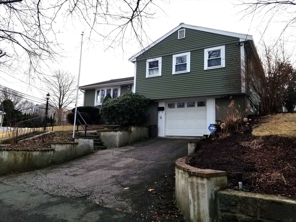 225 Governors Road, Unit 225 Quincy, MA 02169 - Photo 19 of 19 a front view of a house with garden and parking