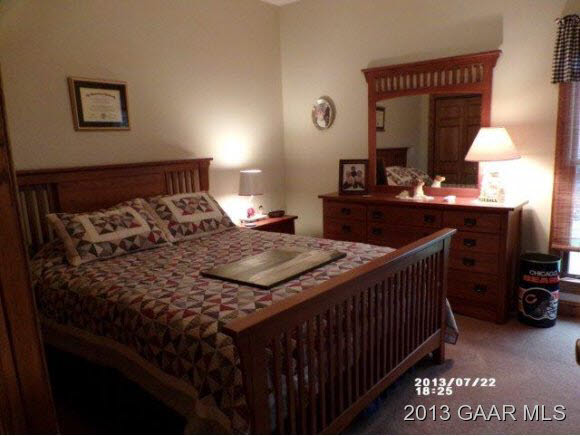 1400 Hermitage Road Waynesboro, VA 22980 - Photo 14 of 23 a bedroom with a bed and a table in it