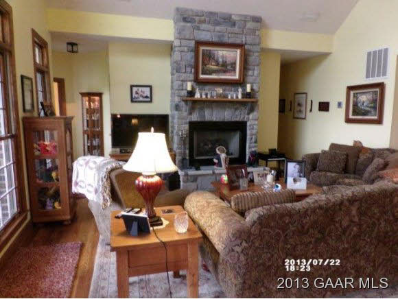 1400 Hermitage Road Waynesboro, VA 22980 - Photo 3 of 23 a living room with furniture a flat screen tv and a fireplace