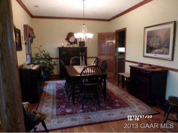 1400 Hermitage Road Waynesboro, VA 22980 - Photo 4 of 23 a dining room with furniture a rug and a chandelier