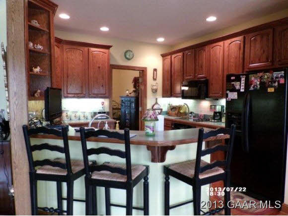 1400 Hermitage Road Waynesboro, VA 22980 - Photo 6 of 23 a kitchen with granite countertop furniture and a refrigerator
