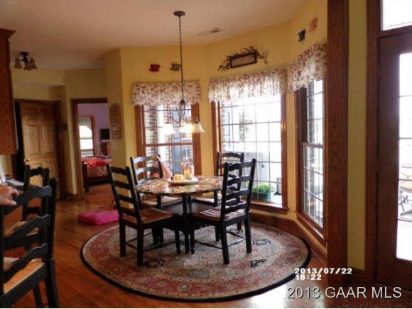 1400 Hermitage Road Waynesboro, VA 22980 - Photo 7 of 23 a dining room with furniture a chandelier and wooden floor