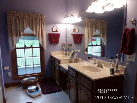 1400 Hermitage Road Waynesboro, VA 22980 - Photo 9 of 23 a bathroom with a sink vanity and a mirror