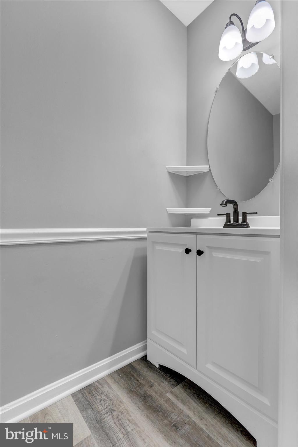 195 St Johns Road West Littlestown, PA 17340 - Photo 14 of 36 a view of a hallway with a large mirror and cabinets