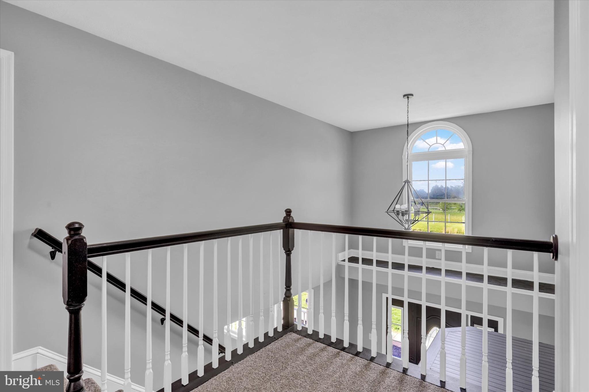 195 St Johns Road West Littlestown, PA 17340 - Photo 15 of 36 a view of staircase with railing and a chandelier