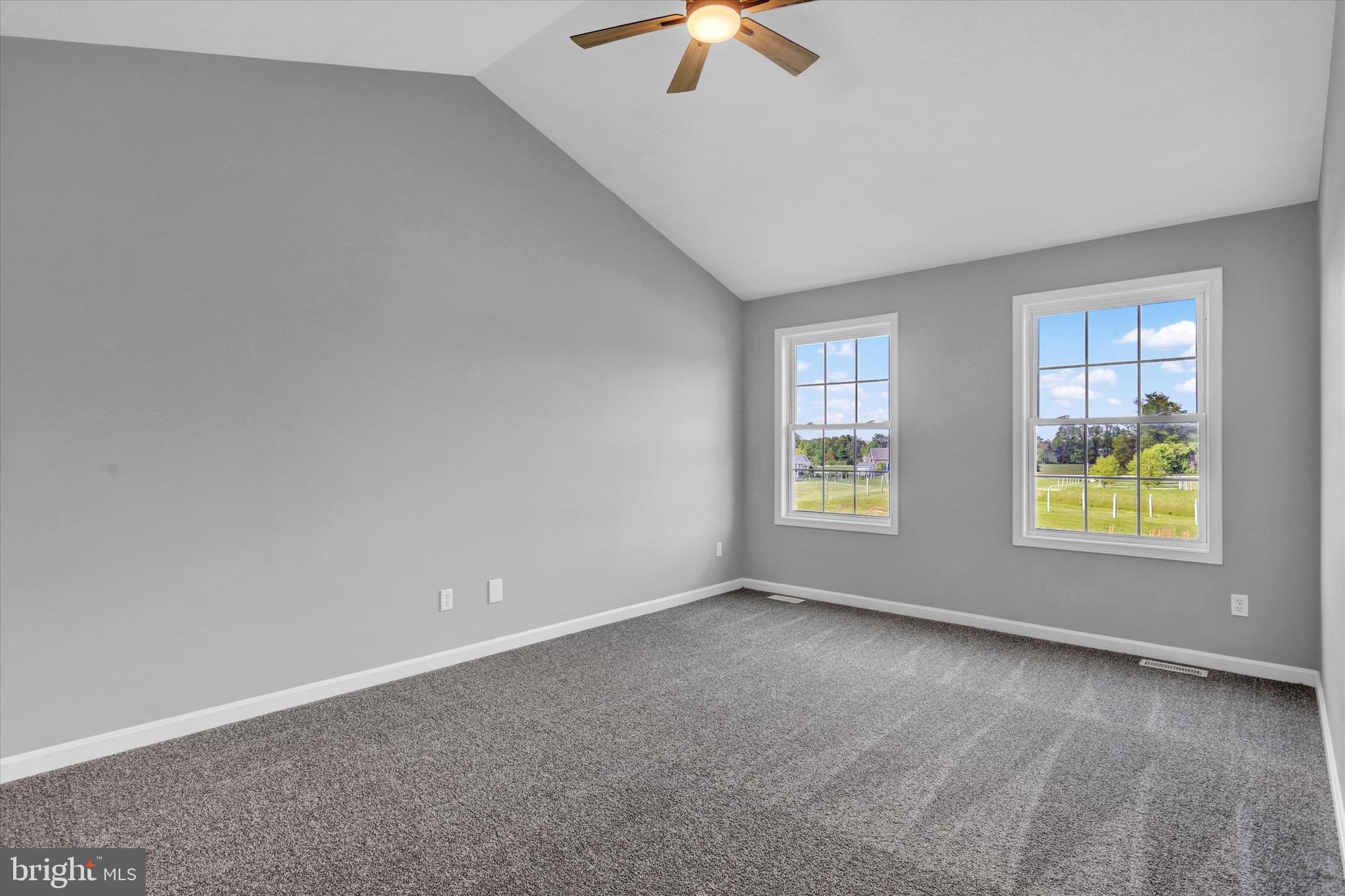195 St Johns Road West Littlestown, PA 17340 - Photo 16 of 36 an empty room with windows and ceiling fan