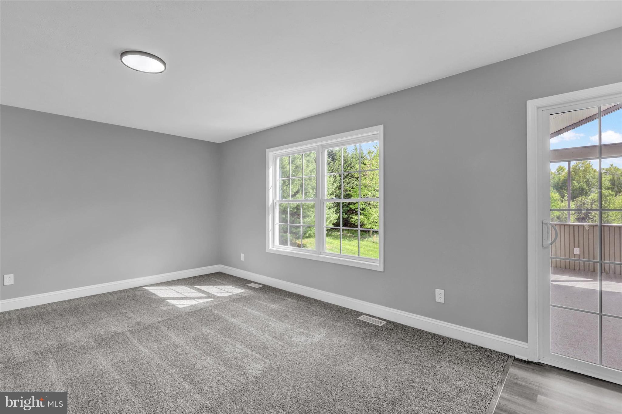 195 St Johns Road West Littlestown, PA 17340 - Photo 9 of 36 a view of an empty room with a window