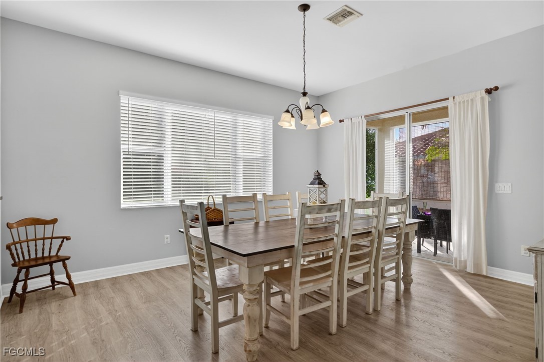 12899 Ivory Stone Loop Fort Myers, FL 33913 - Photo 11 of 40 a view of a dining room with furniture window and outside view