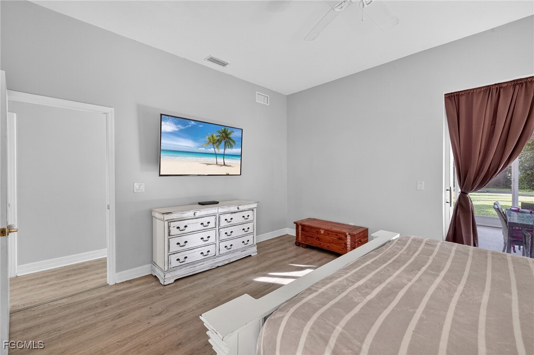 12899 Ivory Stone Loop Fort Myers, FL 33913 - Photo 16 of 40 a bedroom with a bed and a dresser
