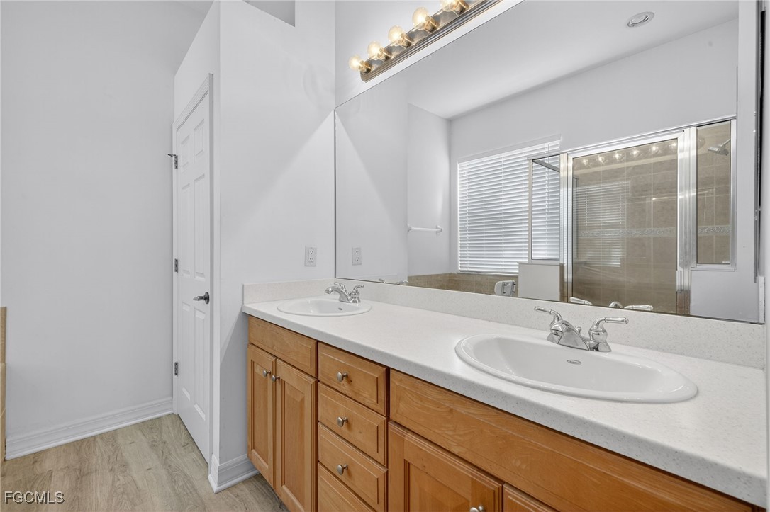 12899 Ivory Stone Loop Fort Myers, FL 33913 - Photo 17 of 40 a bathroom with a sink and a mirror