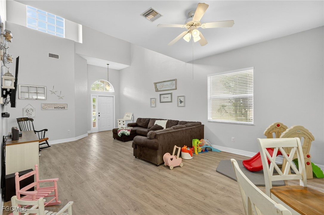 12899 Ivory Stone Loop Fort Myers, FL 33913 - Photo 2 of 40 a living room with furniture and a window
