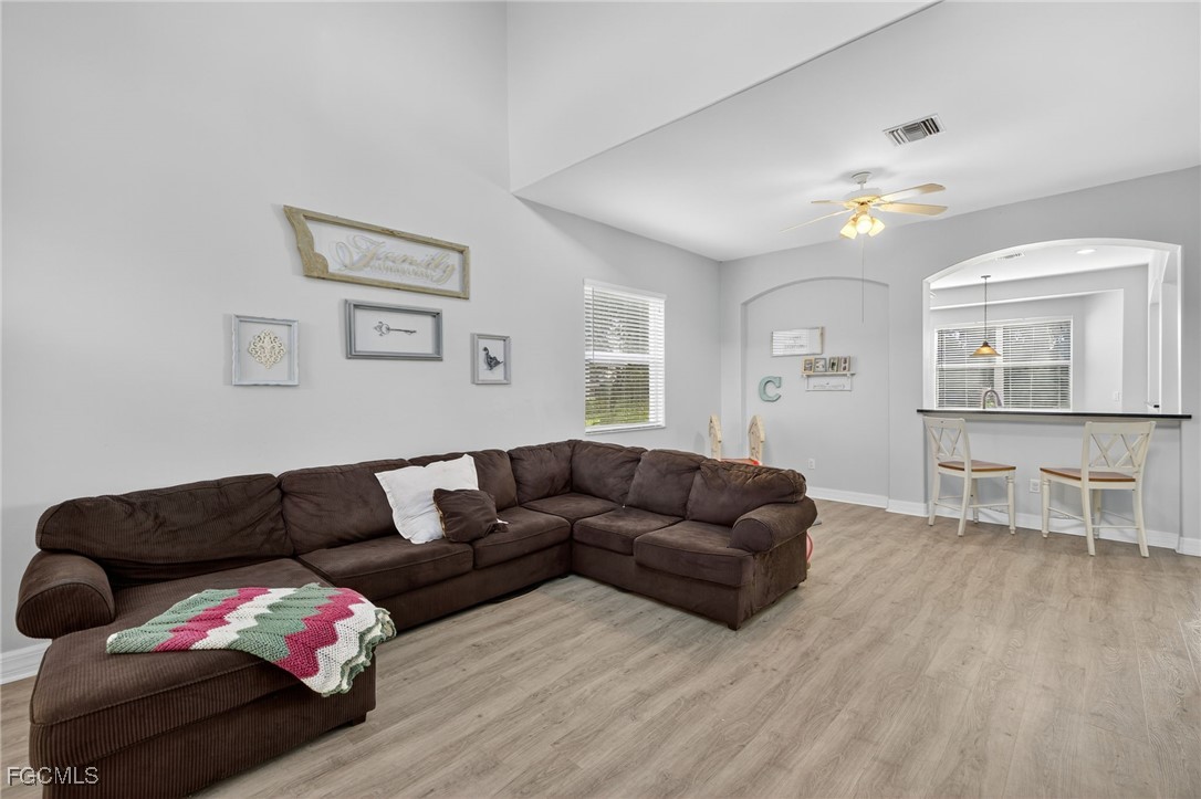 12899 Ivory Stone Loop Fort Myers, FL 33913 - Photo 4 of 40 a living room with furniture and wooden floor