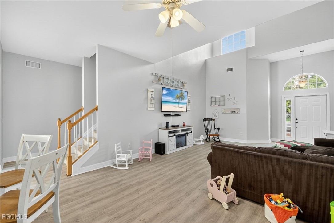 12899 Ivory Stone Loop Fort Myers, FL 33913 - Photo 5 of 40 a living room with furniture and a wooden floor