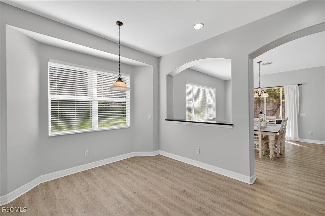 12899 Ivory Stone Loop Fort Myers, FL 33913 - Photo 10 of 40 a view of empty room with wooden floor and fan