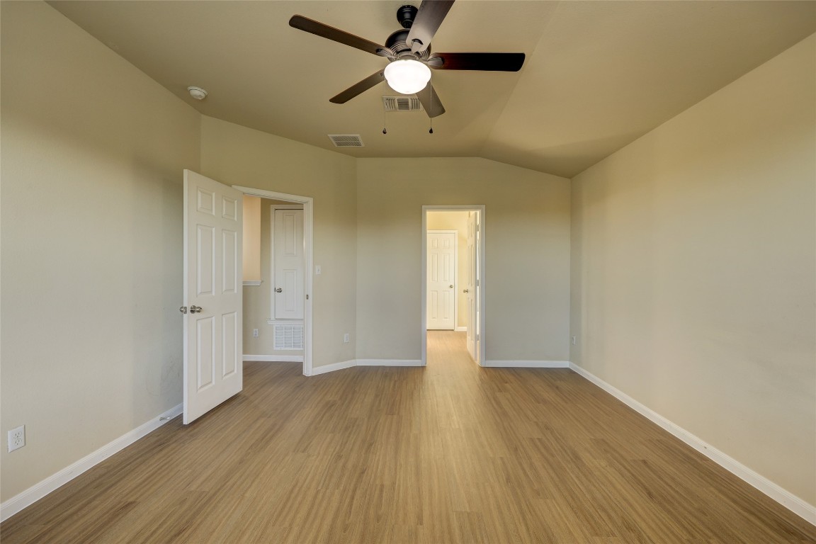 267 Voyager Cove Kyle, TX 78640 - Photo 20 of 40 a view of an empty room and chandelier fan