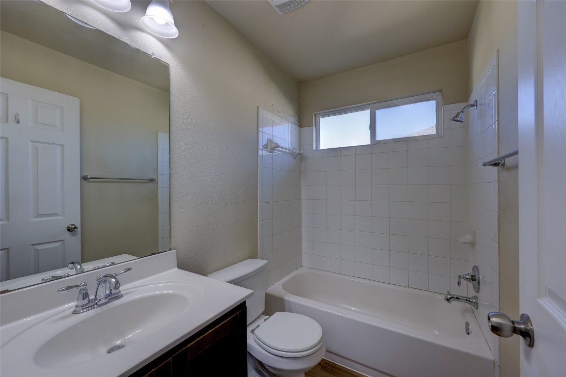 267 Voyager Cove Kyle, TX 78640 - Photo 30 of 40 a bathroom with a sink toilet and shower